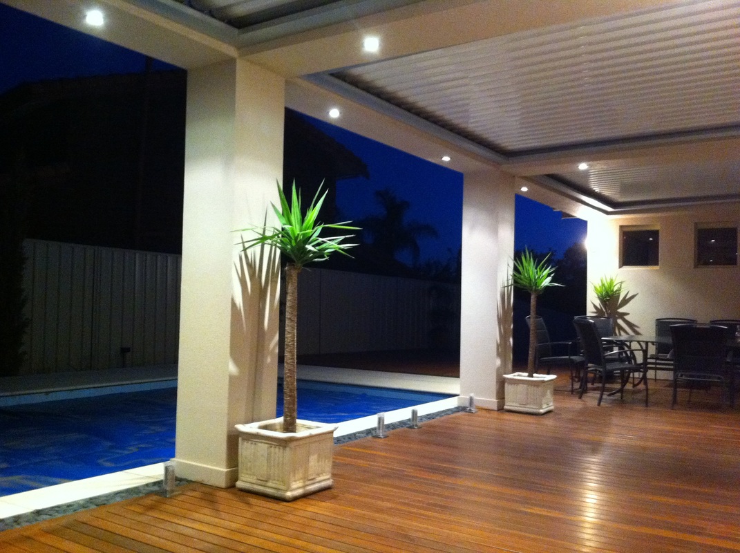 Outdoor Area with Louvred Roof next to Pool